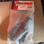 Traxxas TRA5329 Bulkhead, (l&r)/ Diff Retainer, Rear/ 4X14MM Bcs (2) New. Price: $12.30.